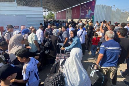 Palestinians with dual citizenship walk at the Rafah border crossing with Egypt, in the hope of getting permission to leave Gaza, amid the ongoing conflict between Israel and Palestinian Islamist group Hamas, in Rafah in the southern Gaza Strip, November 1, 2023. (REUTERS)