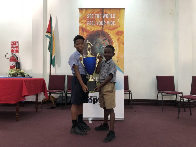 No love lost! Captains Redeemer Adiel Hamilton (left) and St. Pius Clive Jacobs will be battling for the Courts Optical Pee Wee Football Championship.