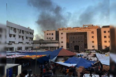 People, including Palestinian children, who fled their house due to Israeli strikes, gather at Al Shifa hospital where they shelter, amid the ongoing conflict between Israel and Palestinian Islamist group Hamas, in Gaza City November 7, 2023. REUTERS/Stringer