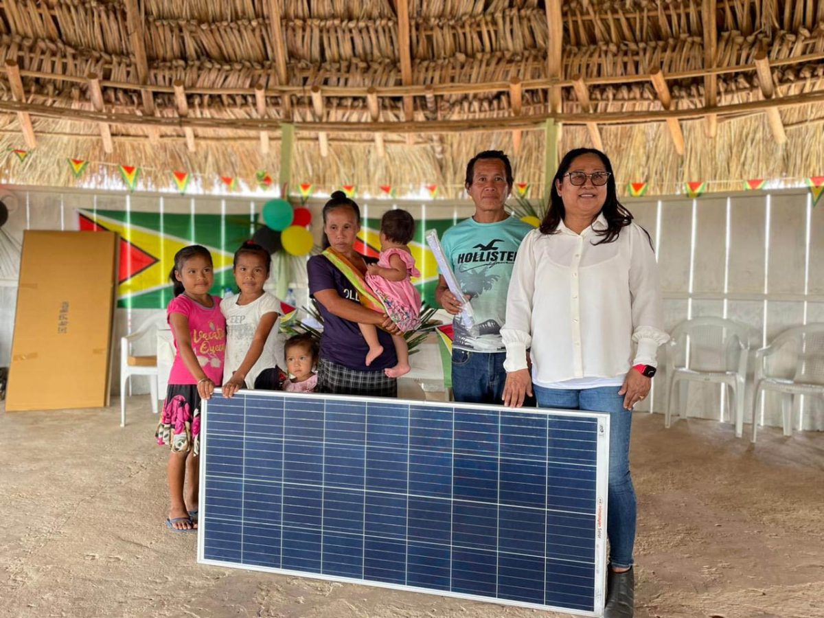 A family that benefited from the solar panels that were distributed to villages 