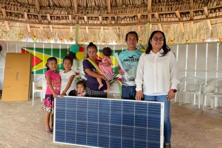 A family that benefited from the solar panels that were distributed to villages 