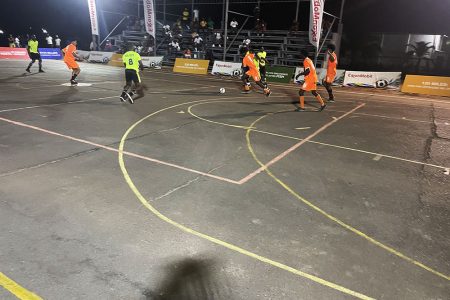 A scene from the Young Gunners (orange) and Money Team quarterfinal clash at the Retrieve Tarmac in the New Era Futsal Championship
