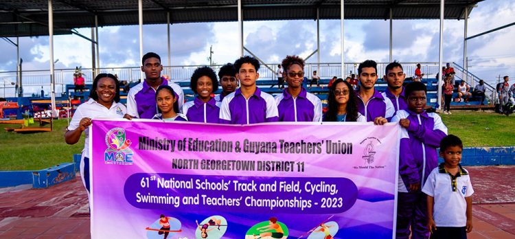 North Georgetown (District 11) were ruthless in their defence of the Swimming championship
at the `Nationals’ yesterday. They won 32 Gold Medals, 5 Silvers and 2 Bronzes overall.  Here, the winning team poses with a banner.