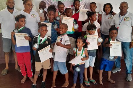 Some of the participants who took part in the `Wrestle Berbice’ workshop with their certificates