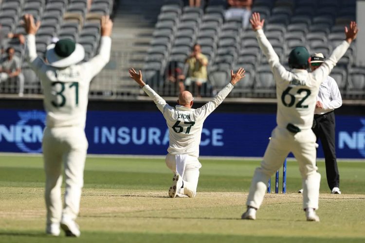 500 Club! Nathan Lyon (centre) successfully appeals against Faheem Ashraf to claim his 500th Test wicket