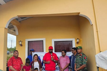 President Ali flanked by Anita Lloyd and her children, Minister of Housing and Water Collin Croal, Senior Minister of Finance Dr Ashni Singh and Chief of Staff of the GDF Omar Khan