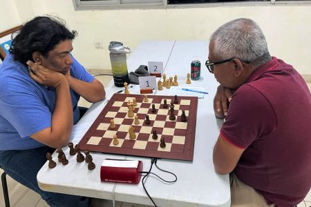 Rehearsal! A scene from the earlier National Open Chess Championship matchup between Candidate Master (CM) Taffin Khan (2005) and Loris Nathoo (1703), which failed to produce an overall winner