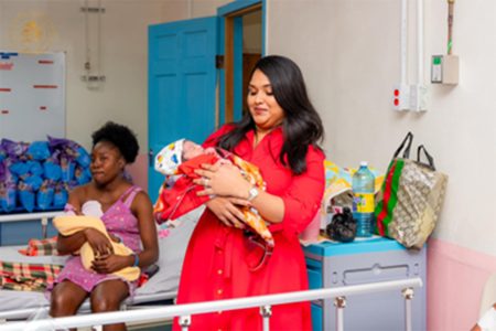 The First Lady with one of the new babies 