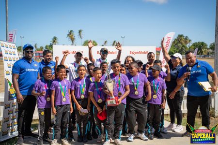 Champions! Cropper Primary School
celebrated their success along with officials from ExxonMobil Guyana and FL Sport.