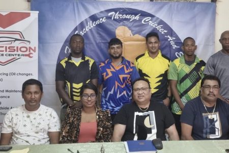 Representatives of some of the participating teams (standing) pose for a photo with sponsors and DCB/GCB President Bissoondyal Singh (centre sitting) at a recent launch of the tournament