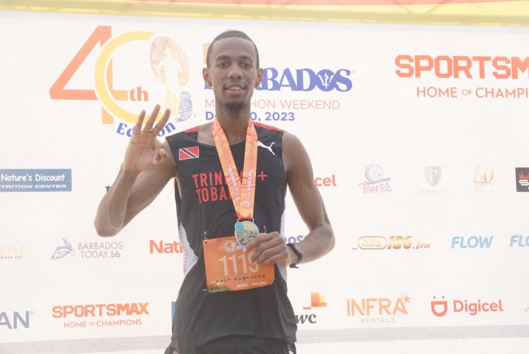 Three in three! Trinidad’s Nicholas Romany was the toast of this weekend’s Run Barbados
festivities after he completed an unprecedented ‘Triple Crown’, winning the PWC Fun Mile,
the Casuarina 10K, and the Sand Dunes Half Marathon event. (Emmerson Campbell photos)
