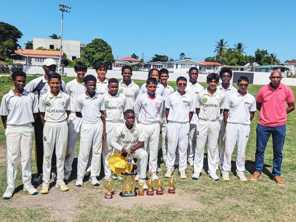 Winner of the DCB U-15 50-over 
tournament, GCA, pose with their trophy