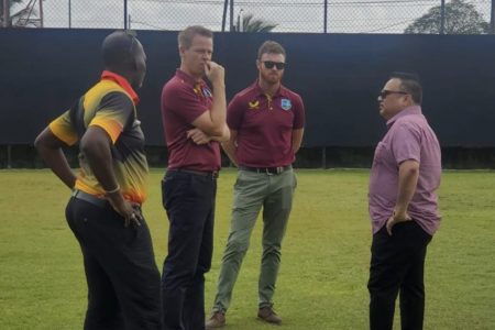 GCB President Bissoondyal Singh (right) and Guyana Harpy Eagles Assistant Coach Garvin Nedd (left) interact with CWI HP Manager Graeme West (2nd from left) and Coach Education Head Chris Brabazon (2nd from right).
