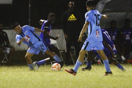 A scene from the Clarendon College and Chase Academy (light blue) encounter in the KFC Goodwill Football Championship