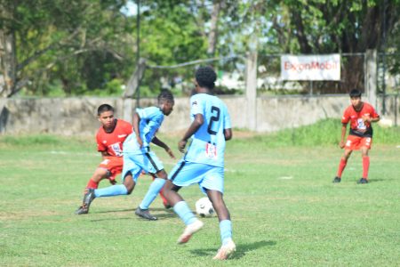 Bryan Wharton (2nd from left) of Chase Academy on the attack against St Ignatius
