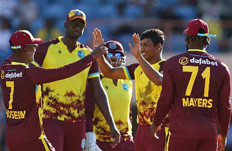 Left-arm spinner Gudakesh Motie (second from right) celebrates his wicket during Thursday’s second T20 International against England. 