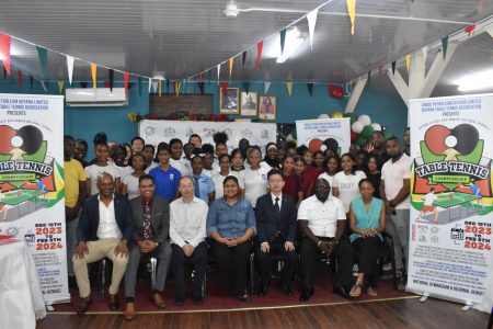 Minister of Education (sitting centre) Priya Manickchand posing with other officials of the
unveiling party following the official launch ceremony for the Nationwide Schools Table Tennis Championship