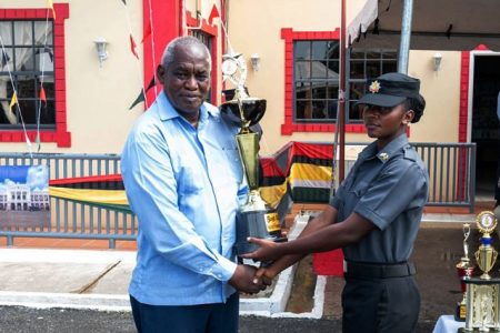 Minister of Home Affairs, Robeson Benn and the best-graduating firefighter for course two of 2023, Ja’el Yarris (DPI photo)