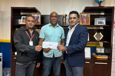 Tournament coordinator Stanley Lancaster (centre) receives the sponsorship check from Chairman Zakir Hack (right) and CEO Byron Biswah
