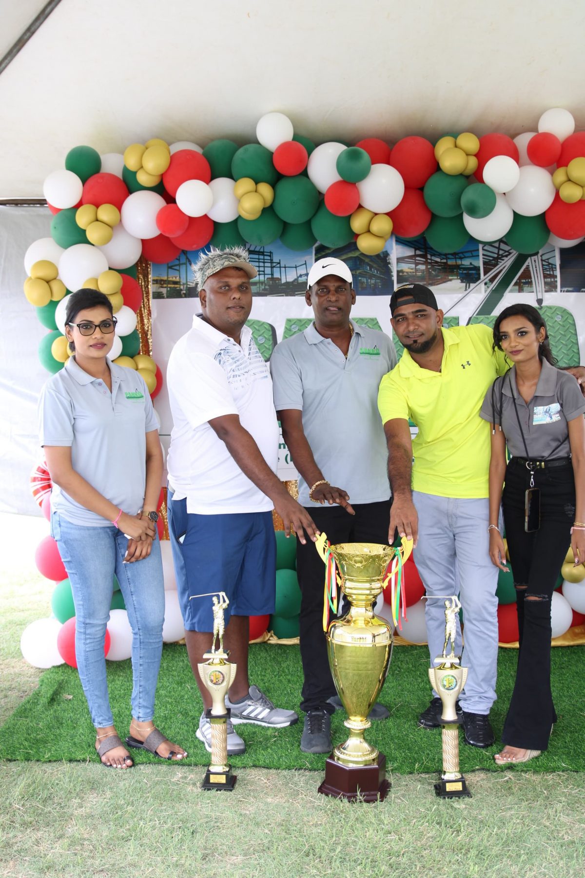 The victorious duo of Romel Bhagwandin (2nd from left) and Robin Tiwari (4th from left) displaying their championship