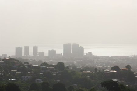 A view of Port-of-Spain from the Lady Young Road shows the city blanketed by Saharan Dust yesterday.