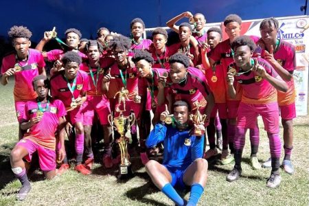 The victorious Upper Demerara side posing with their spoils after winning the NAMILCO U17 Association Football League Championship