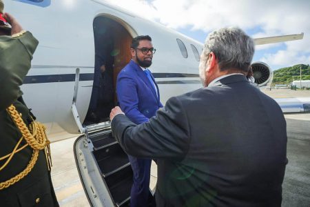 President Irfaan Ali being greeted upon his arrival in St Vincent and the Grenadines on Thursday by Prime Minister Ralph Gonsalves. (Office of the President photo)
