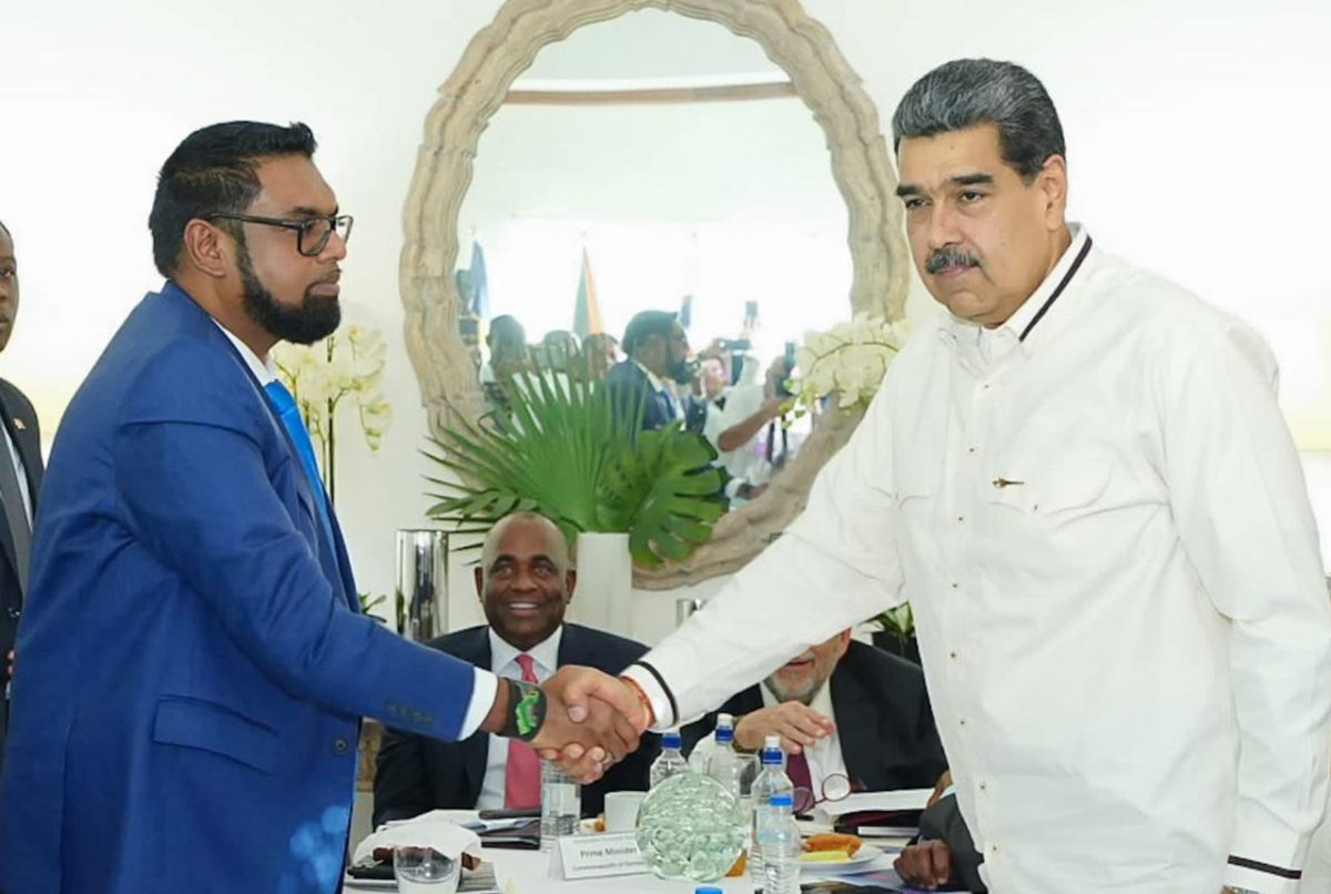 President Irfaan Ali (left) and Venezuelan President Nicolas Maduro shaking hands at one of their meetings yesterday, (Office of the President photo)