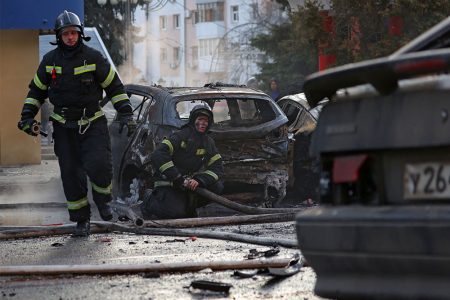 Firefighters work to extinguish burning cars following what Russian authorities say was a Ukrainian military strike in Belgorod, Russia December 30, 2023. REUTERS/Stringer