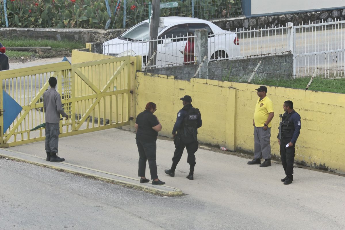 Police officers on the compound of Courts Megastore in San Juan, after Sunday’s shooting of five people by an off-duty police officer.