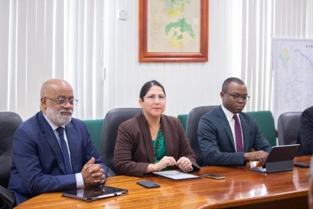 From left are Anton Edmunds and Lorena Solorzano-Salazar (Ministry of Finance photo)