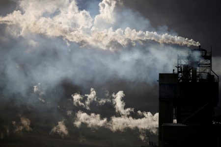 FILE PHOTO: A view shows emissions from the chimneys of Yara France plant in Montoir-de-Bretagne near Saint-Nazaire, France, March 4, 2022. REUTERS/Stephane Mahe/File Photo