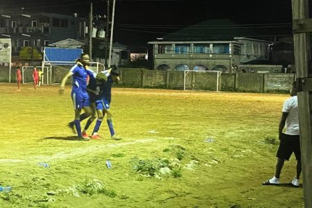 The injured player being carried off by his teammates as alluded to by MP Juretha Fernandes
