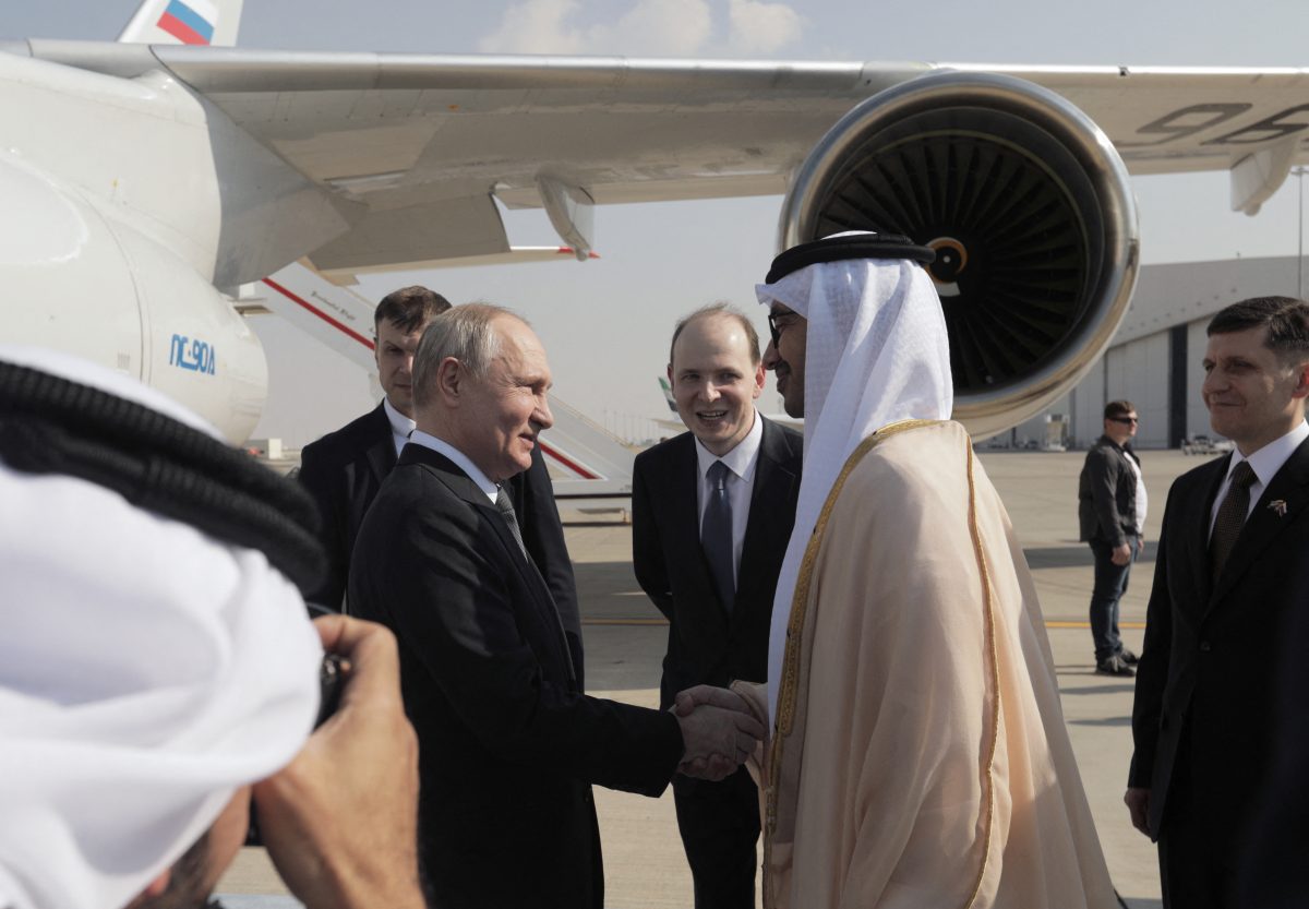 Russian President Vladimir Putin is welcomed by Minister of Foreign Affairs of the United Arab Emirates Sheikh Abdullah bin Zayed bin Sultan Al Nahyan upon arrival at the Abu Dhabi International Airport, United Arab Emirates December 6, 2023. Sputnik/Andrey Gordeev/Pool via REUTERS