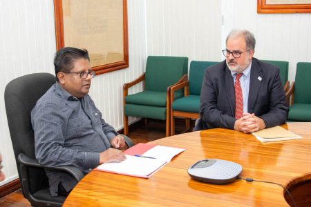 Finance Minister Dr Ashni Singh (left) at the meeting