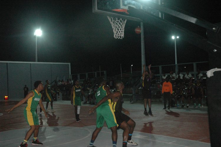 Jonathan Pooran of Mambas attempts a mid-range jumper against Kwakwani
