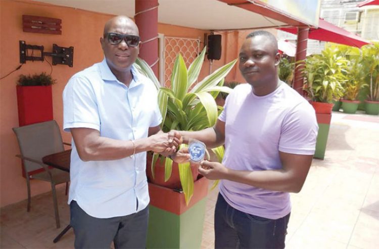 One-Star Referee Lawrence Assanah (right) receiving his
accreditation insignia from GBA President Steve Ninvalle