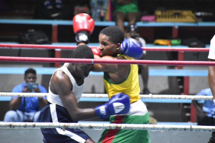 Action between Mark Crawford (left) and Colin Hinds in the middleweight section