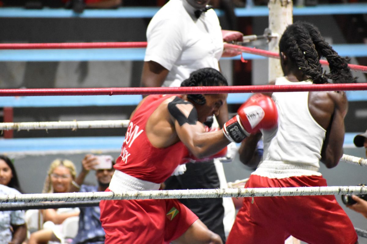 Keevin Allicock (left) lands a right hook to the back of Stephon Barton