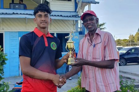 Berbice’s Arif Khan receives his Man-of-the-Match award for his brilliant all-round performance