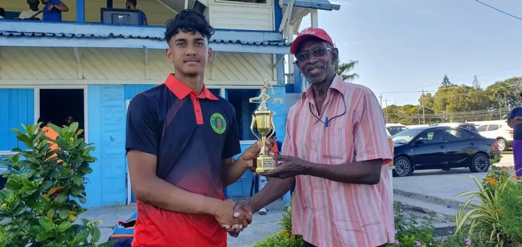 Berbice’s Arif Khan receives his Man-of-the-Match award for his brilliant all-round performance