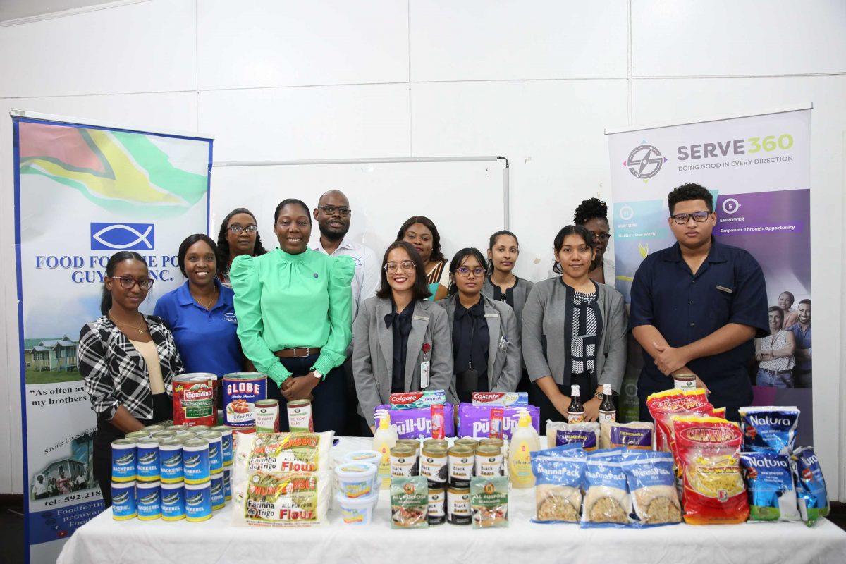 Representatives of FTTP and the Marriott Hotel pose with products intended for distribution 