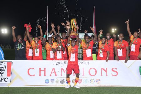 Flashback! GDF Captain Kenard Simon hoists the KFC Elite League trophy following their defeat of their arch-rival, the Guyana Police Force, to seal a perfect record in season five