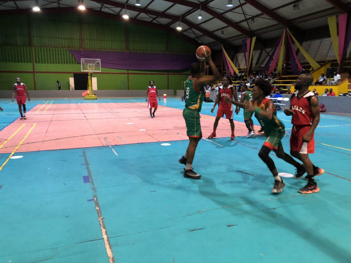 Action in the ‘One Guyana’ Basketball League Playoffs between the Eagles (red) and UG Trojans