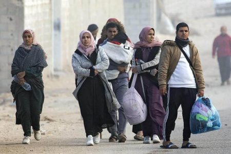 Displaced Palestinians walk along the coastal road, after the Israeli army told Khan Younis camp residents to leave and go to the camp at Rafah, near the Egyptian border. PHOTO: EPA-EFE