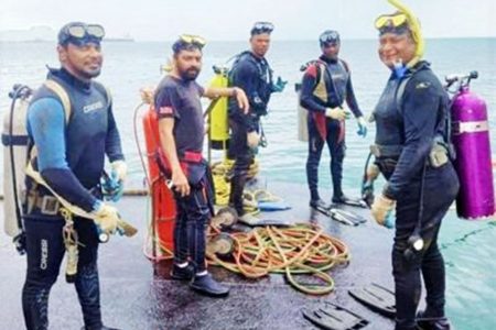 The divers: Christopher Boodram, Fyzal Kurban, Rishi Nagassar, Kazim Ali Jr and Yusuf Henry. Only Boodram (at left) made it out.