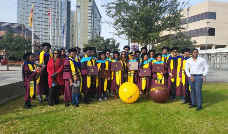 The scholars posing for the photo in Phoenix, Arizona. Six scholars who could not attend the December ceremony are not in this UG photo.  