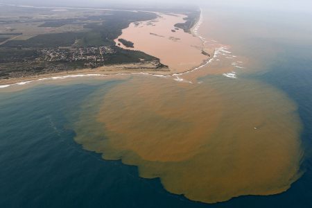 An aerial view of the Rio Doce (Doce River), which was flooded with mud after a dam owned by Vale SA and BHP Billiton Ltd burst, at an area where the river joins the sea on the coast of Espirito Santo in Regencia Village, Brazil, November 23, 2015. REUTERS/Ricardo Moraes/File