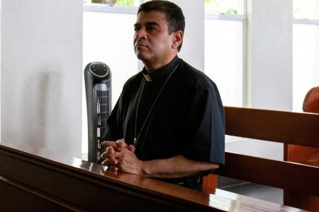FILE PHOTO: Rolando Alvarez, bishop of the Diocese of Matagalpa and a critic of the Nicaraguan President Daniel Ortega, shown praying at Managua's Catholic church where he was taking refuge, alleging he had been targeted by the police, in Managua, Nicaragua May 20, 2022. REUTERS/Maynor Valenzuela/File Photo