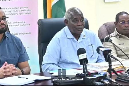 From left to right are Minister of Home Affairs Permanent Secretary Andre Ally, Minister of Home Affairs Robeson Benn and Commissioner of Police (ag) Clifton Hicken.